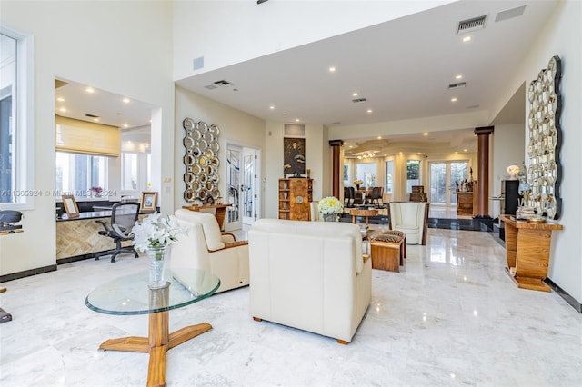 living room featuring ornate columns