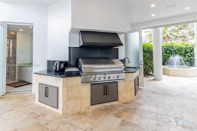 view of patio featuring area for grilling and sink