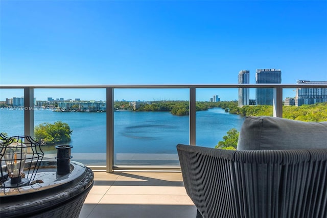 balcony featuring a water view