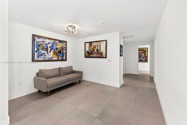 interior space featuring an inviting chandelier and light tile flooring