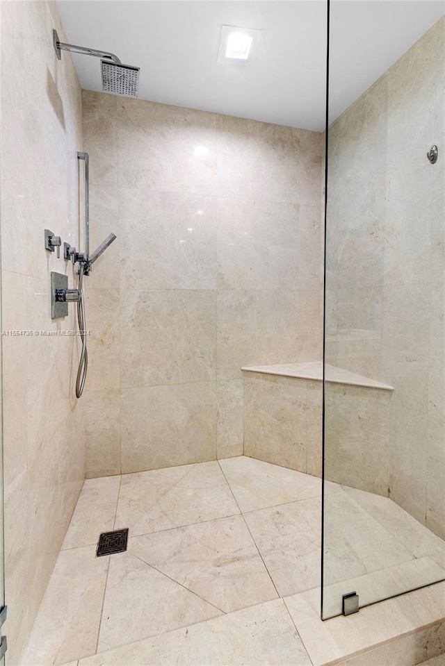 bathroom with tiled shower