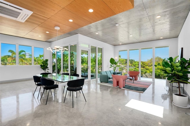 sunroom featuring an inviting chandelier