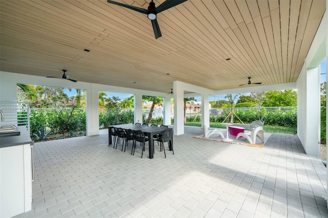 view of patio / terrace with ceiling fan and sink