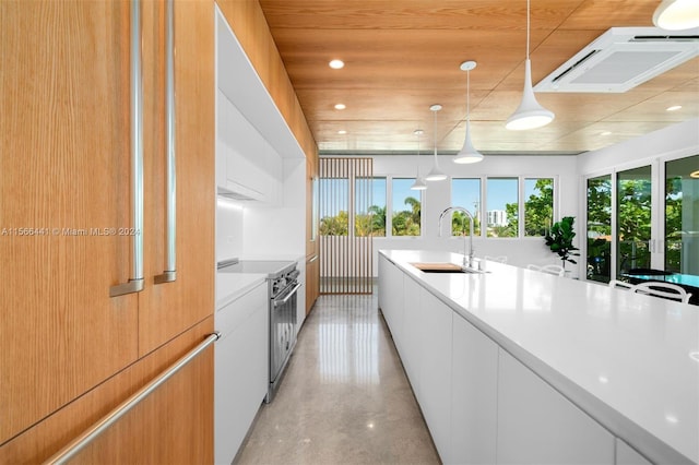 kitchen with sink, pendant lighting, electric range, white cabinets, and fridge