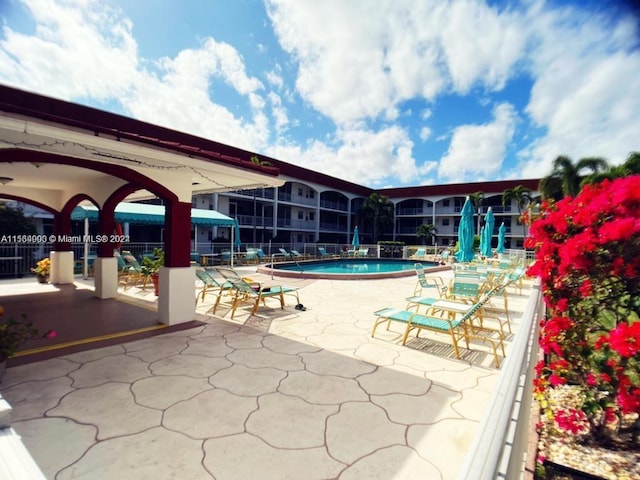 view of swimming pool featuring a patio