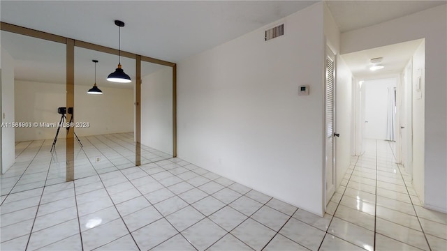 empty room with light tile flooring