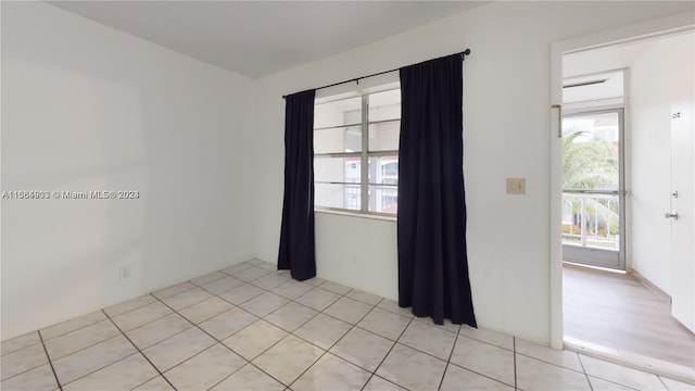 empty room with light hardwood / wood-style flooring