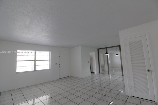 empty room featuring light tile floors