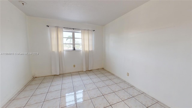 view of tiled spare room