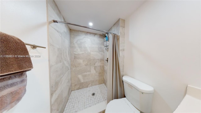 bathroom with walk in shower and toilet