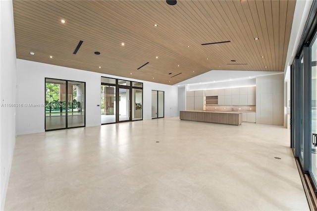 interior space featuring wooden ceiling, high vaulted ceiling, and recessed lighting