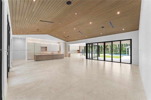 interior space with lofted ceiling, wooden ceiling, and recessed lighting