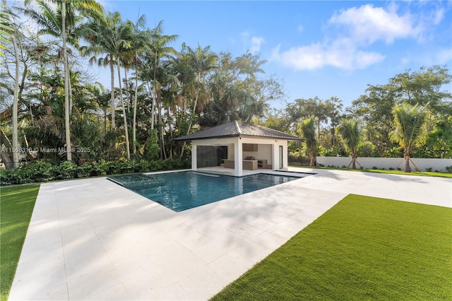 view of swimming pool featuring a patio, fence, a gazebo, a yard, and a fenced in pool