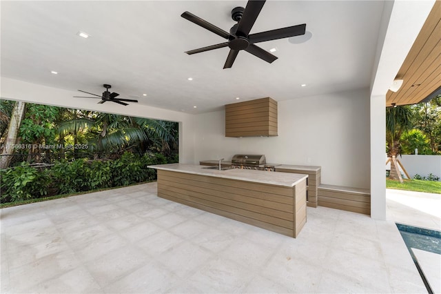 view of patio / terrace featuring ceiling fan, area for grilling, and fence