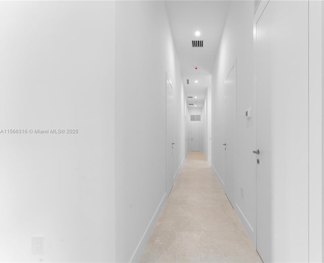 corridor with visible vents and recessed lighting