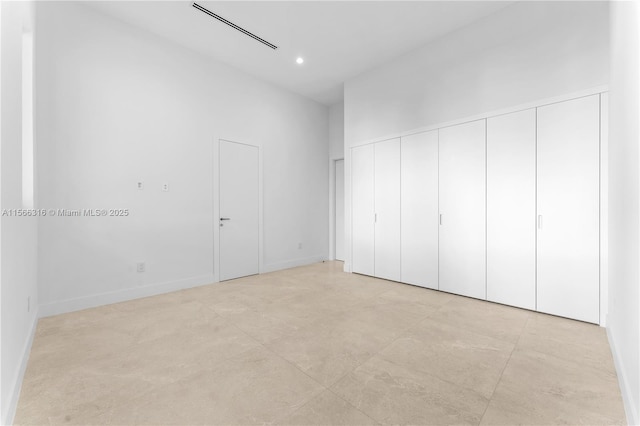 unfurnished bedroom with baseboards and recessed lighting