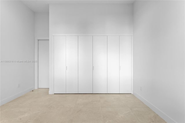 unfurnished bedroom featuring baseboards