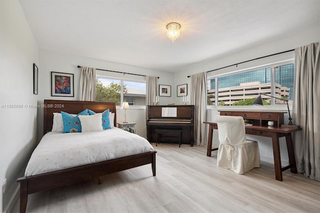 bedroom with light hardwood / wood-style flooring