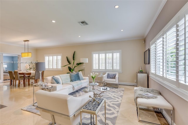 tiled living room with crown molding and a healthy amount of sunlight