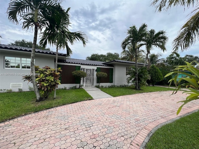 view of front of home with a front yard