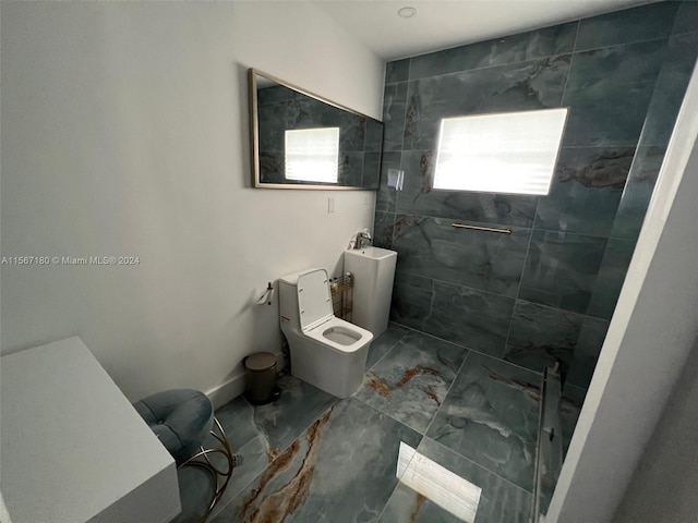 bathroom with tile flooring and tiled shower