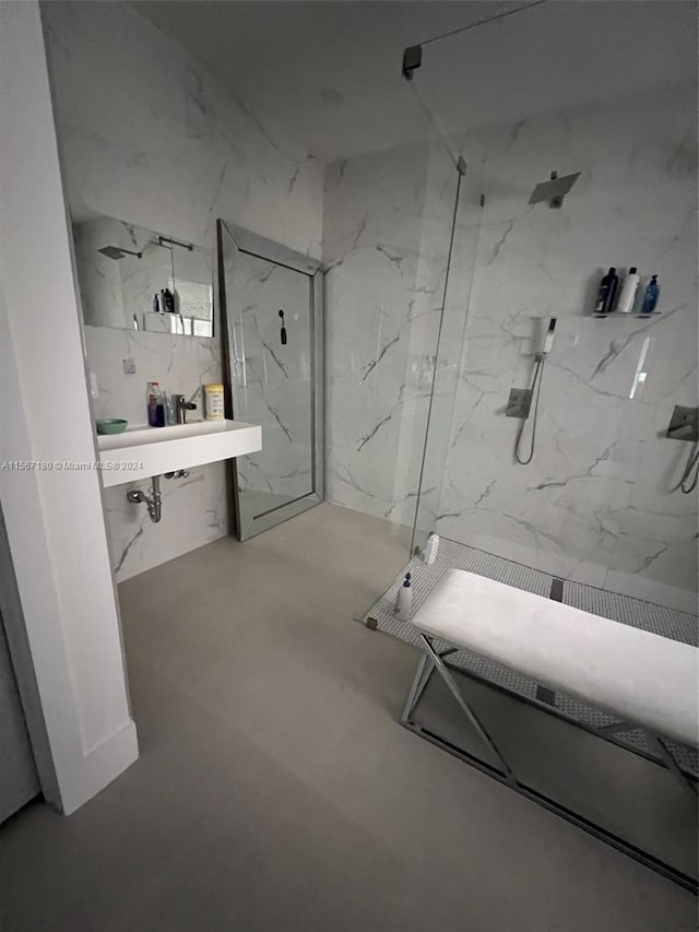 bathroom featuring a shower and concrete flooring