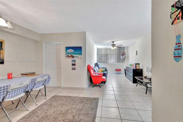 tiled foyer entrance featuring ceiling fan