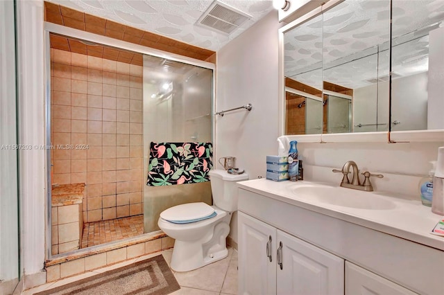 bathroom featuring an enclosed shower, tile floors, tile walls, vanity, and toilet