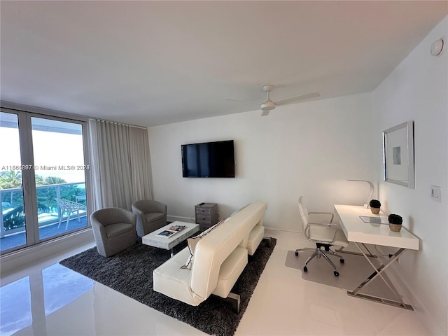 living room with concrete flooring and ceiling fan