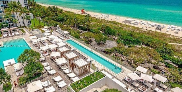 bird's eye view with a view of the beach and a water view