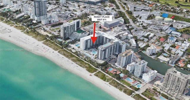 aerial view featuring a view of the beach and a water view