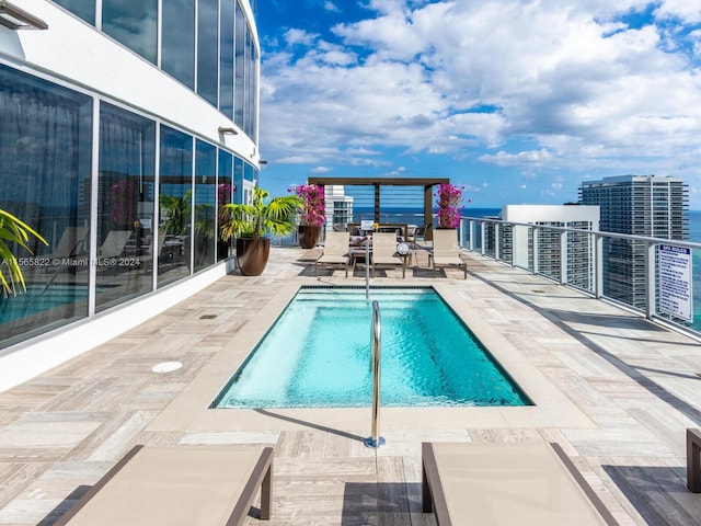 view of swimming pool featuring a patio area