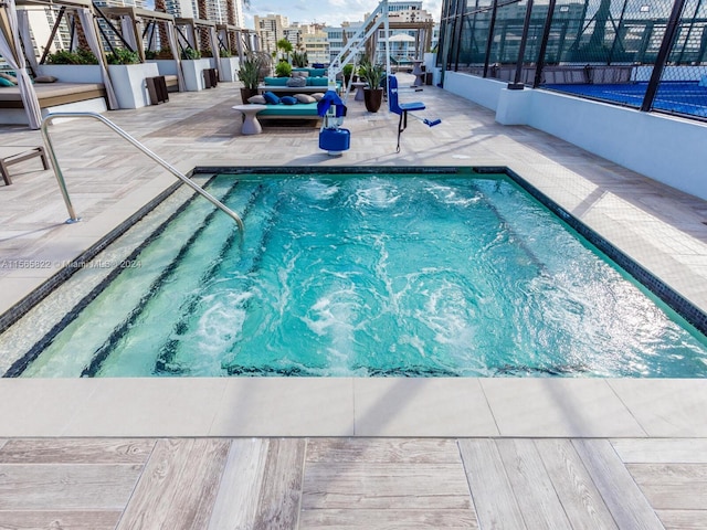 view of swimming pool with a patio