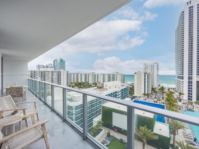 balcony featuring a water view