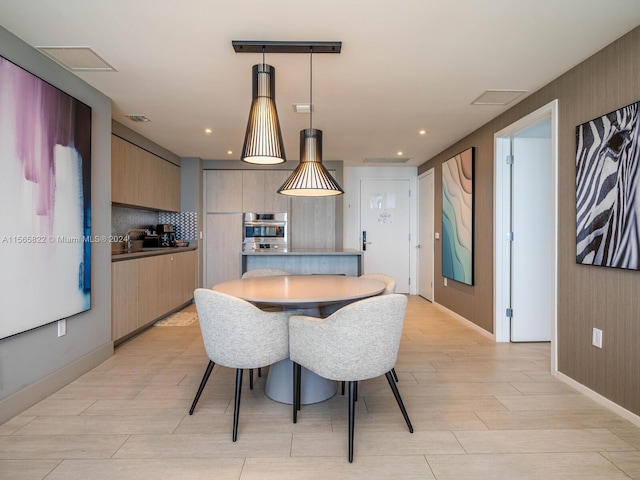 dining area with light wood-type flooring