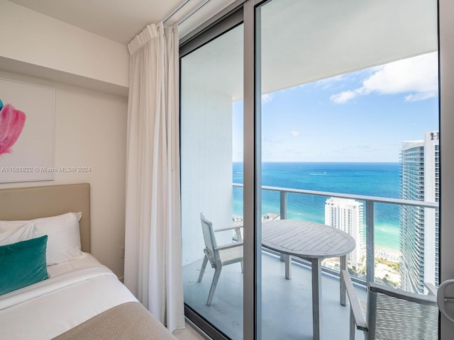 bedroom featuring a water view