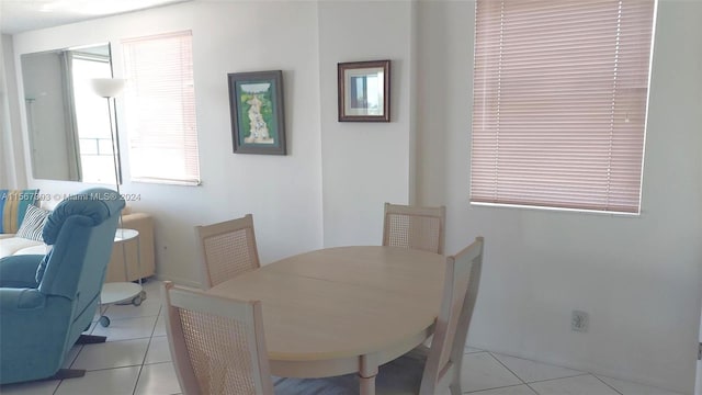 dining space with light tile patterned floors