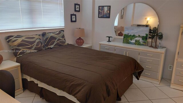 bedroom featuring light tile patterned floors