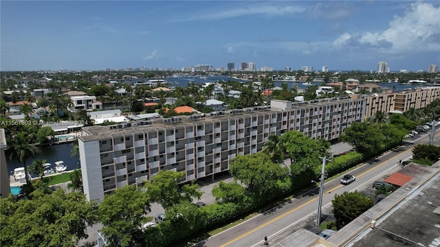 drone / aerial view with a city view and a water view