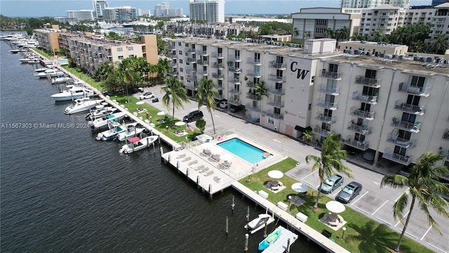 bird's eye view featuring a view of city and a water view