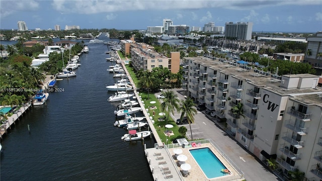 bird's eye view featuring a water view and a view of city