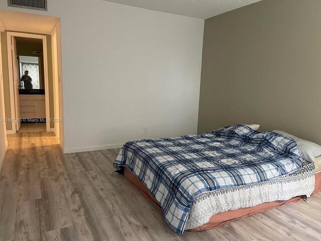 bedroom featuring light hardwood / wood-style flooring