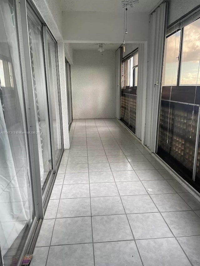 hallway featuring light tile flooring