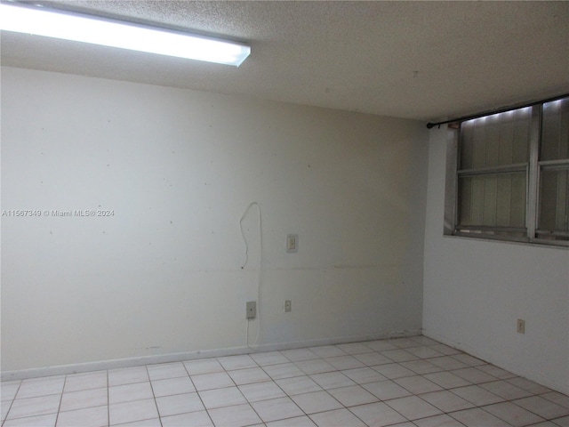 empty room featuring a textured ceiling