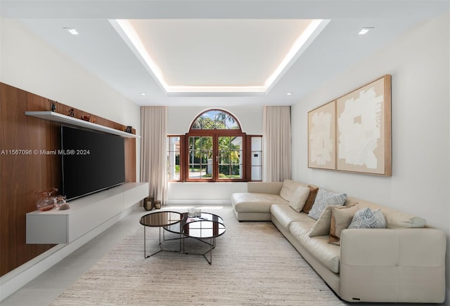 living room with a tray ceiling