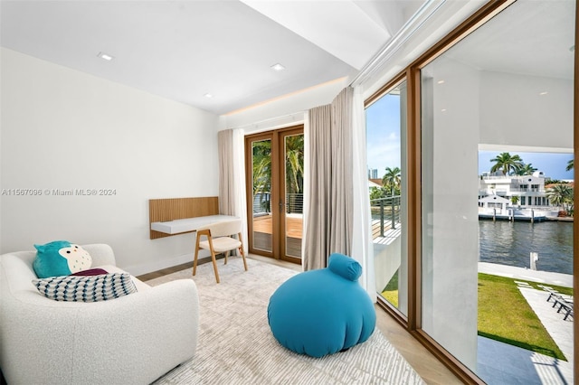 sitting room featuring a water view