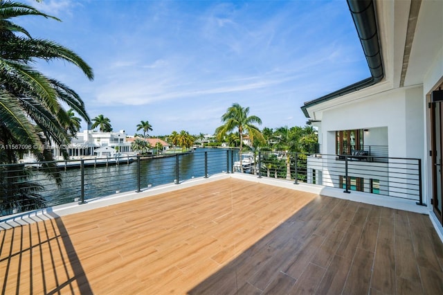 wooden terrace with a water view