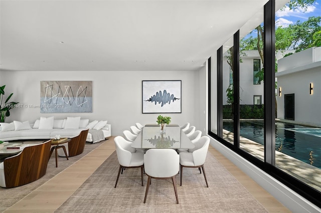 dining area with light wood-type flooring