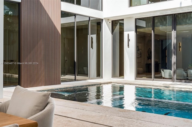 view of swimming pool featuring a patio area