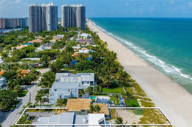 birds eye view of property featuring a water view and a view of the beach